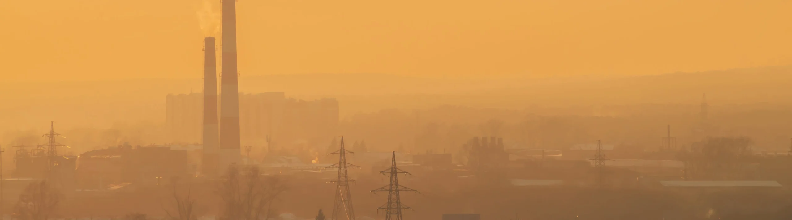 Smog_silhouettes_of_buildings_smokestack_environmental_pollution_urban_fumes-scaled